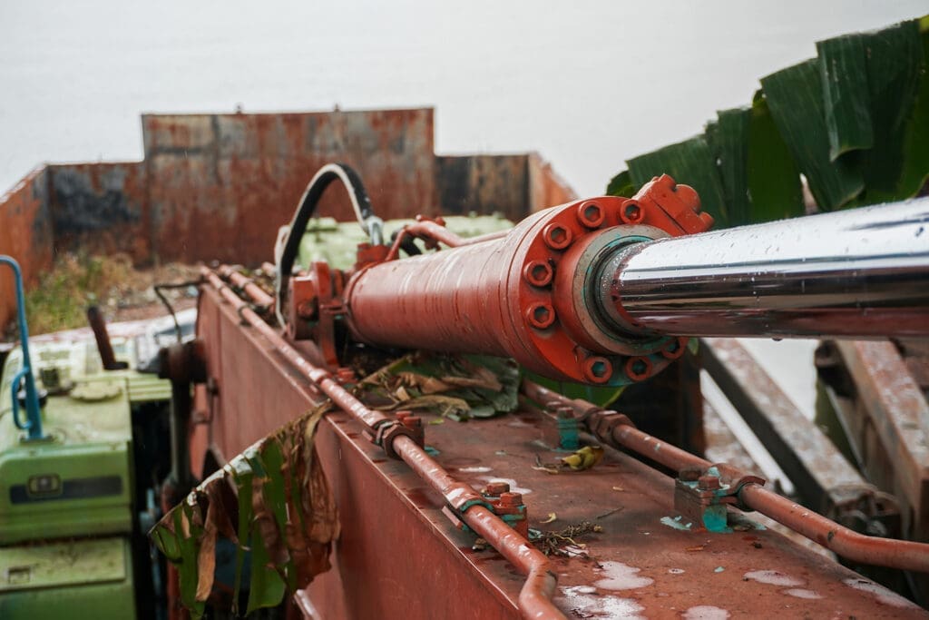 Close-up of a hydraulic cylinder on industrial machinery
